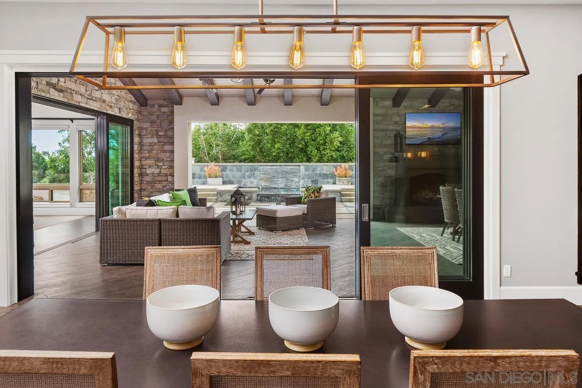 8330 Artesian Road San Diego, CA 92127 - Photo 7 of 26 a living room with furniture a window and a potted plant