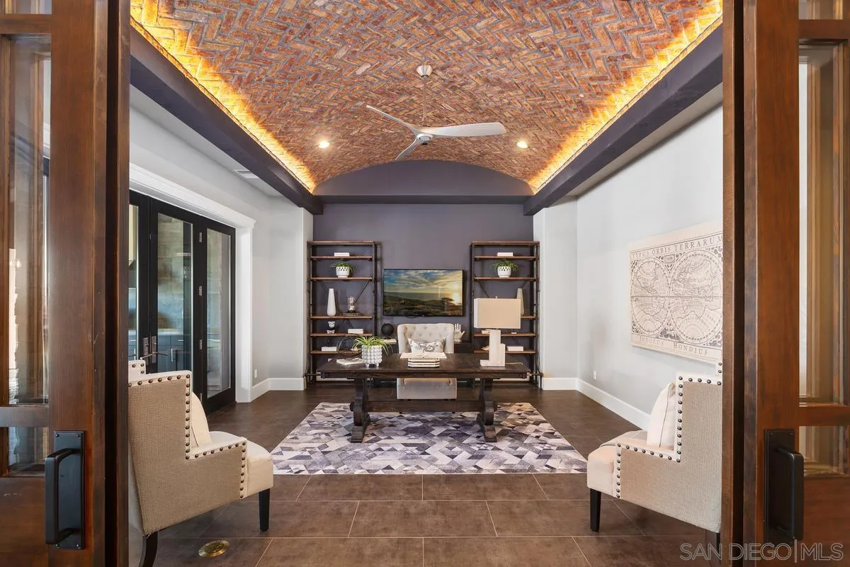 8330 Artesian Road San Diego, CA 92127 - Photo 9 of 26 a living room with furniture a rug and a large window