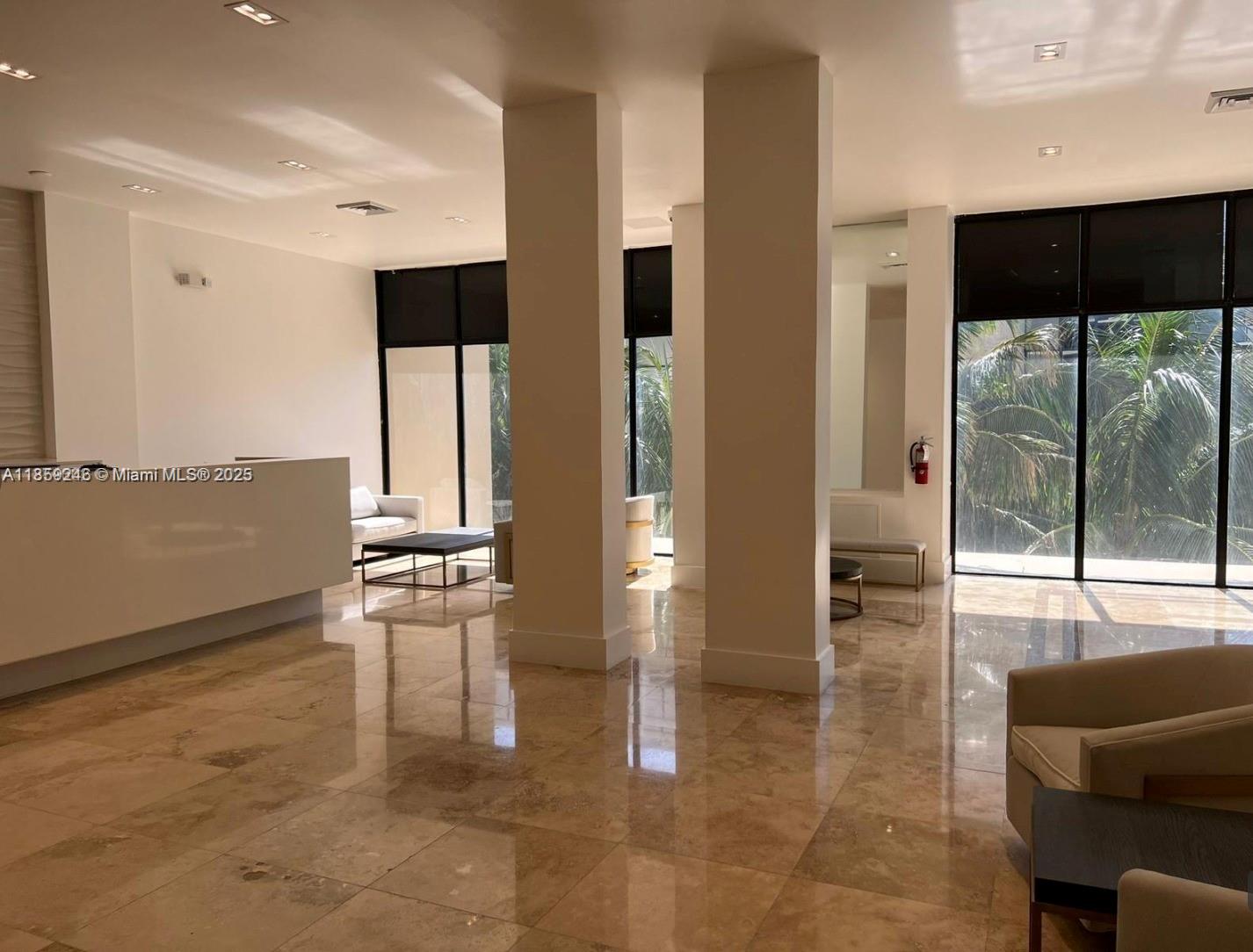 2101 South Ocean Drive, Unit 2004 Hollywood, FL 33019 - Photo 14 of 15 a lobby with furniture and floor to ceiling window