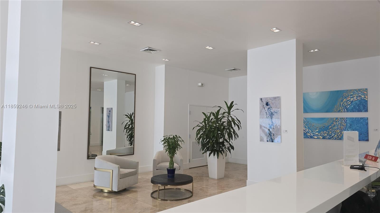 2101 South Ocean Drive, Unit 2004 Hollywood, FL 33019 - Photo 15 of 15 a hallway with potted plants and white walls