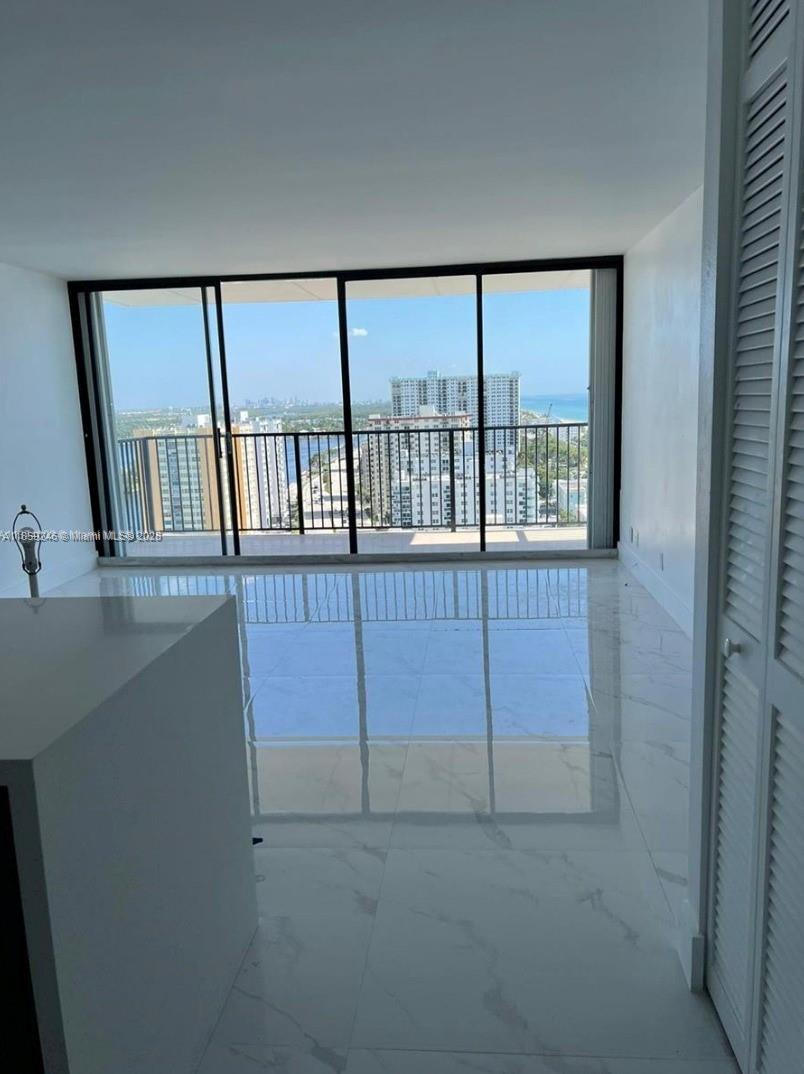 2101 South Ocean Drive, Unit 2004 Hollywood, FL 33019 - Photo 2 of 15 a view of a hallway with windows