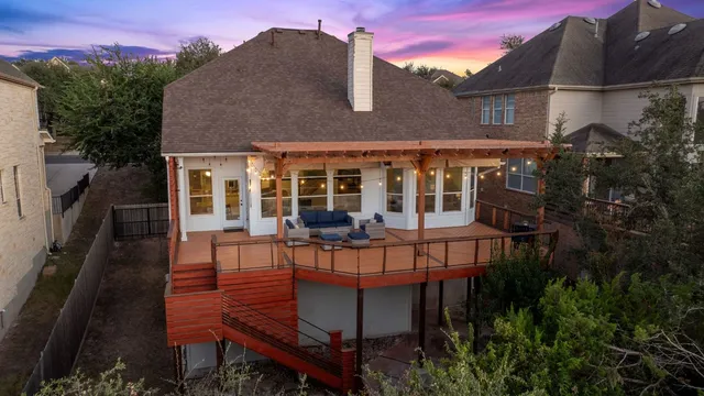 a view of a city from a balcony with a yard