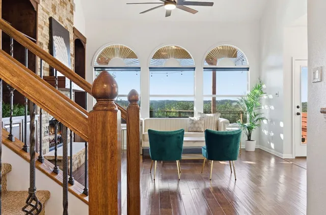 a view of house with outdoor seating space and wooden floor