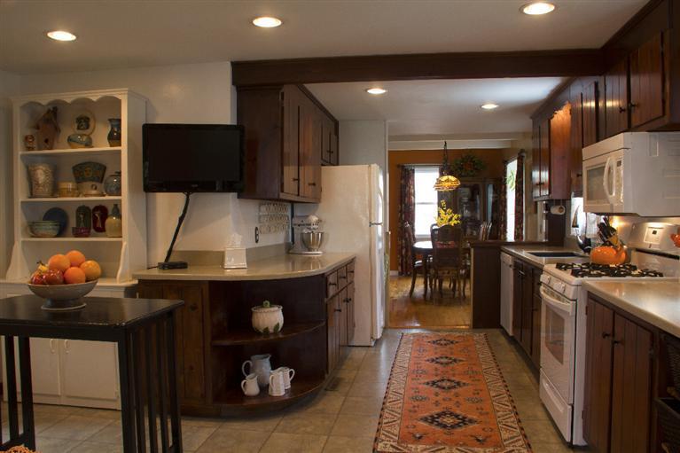 808 Old Stage Road Centerville, MA 02632 - Photo 11 of 35 a kitchen with stainless steel appliances granite countertop a sink and a refrigerator