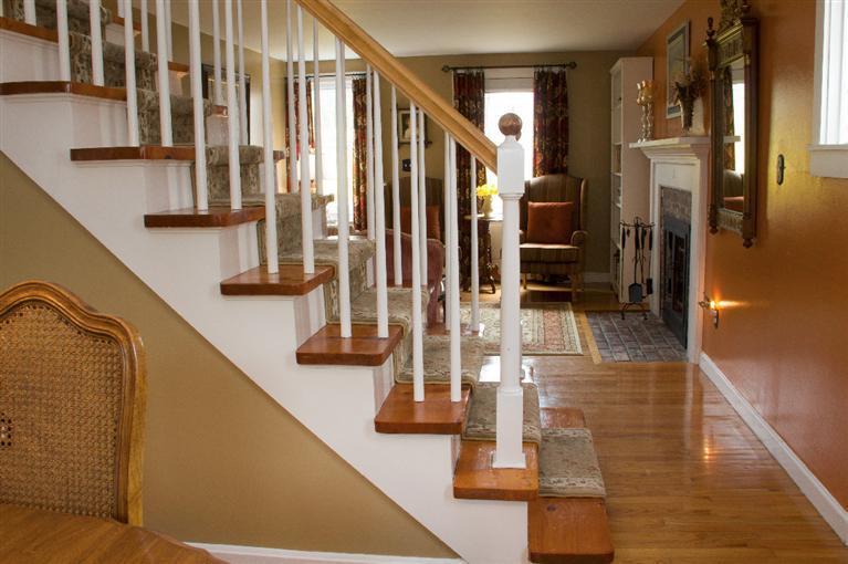 808 Old Stage Road Centerville, MA 02632 - Photo 19 of 35 a view of staircase with lots of frames on wall and windows