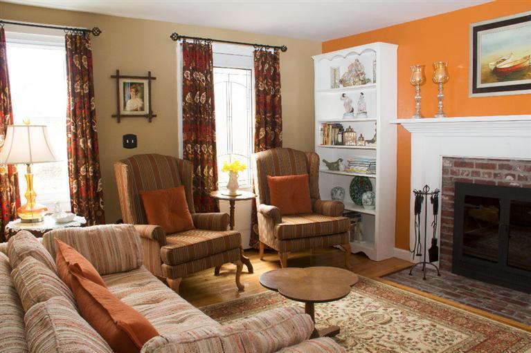 808 Old Stage Road Centerville, MA 02632 - Photo 21 of 35 a living room with furniture and a fireplace