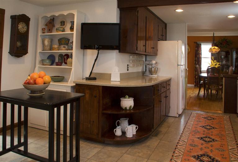 808 Old Stage Road Centerville, MA 02632 - Photo 10 of 35 a kitchen with stainless steel appliances a stove a refrigerator and a dining table
