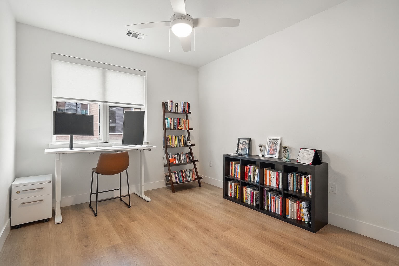 1701 Simond Avenue, Unit 305 Austin, TX 78723 - Photo 11 of 31 a room with furniture and a book shelf