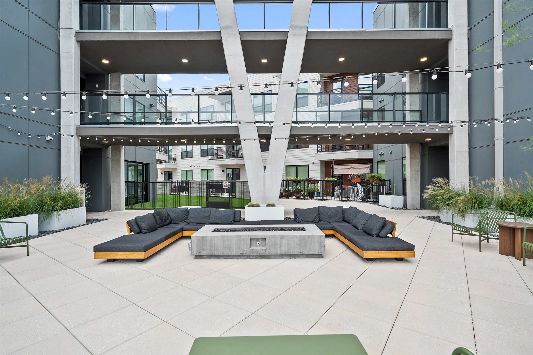 1701 Simond Avenue, Unit 305 Austin, TX 78723 - Photo 16 of 31 a building outdoor space with patio couches and potted plants