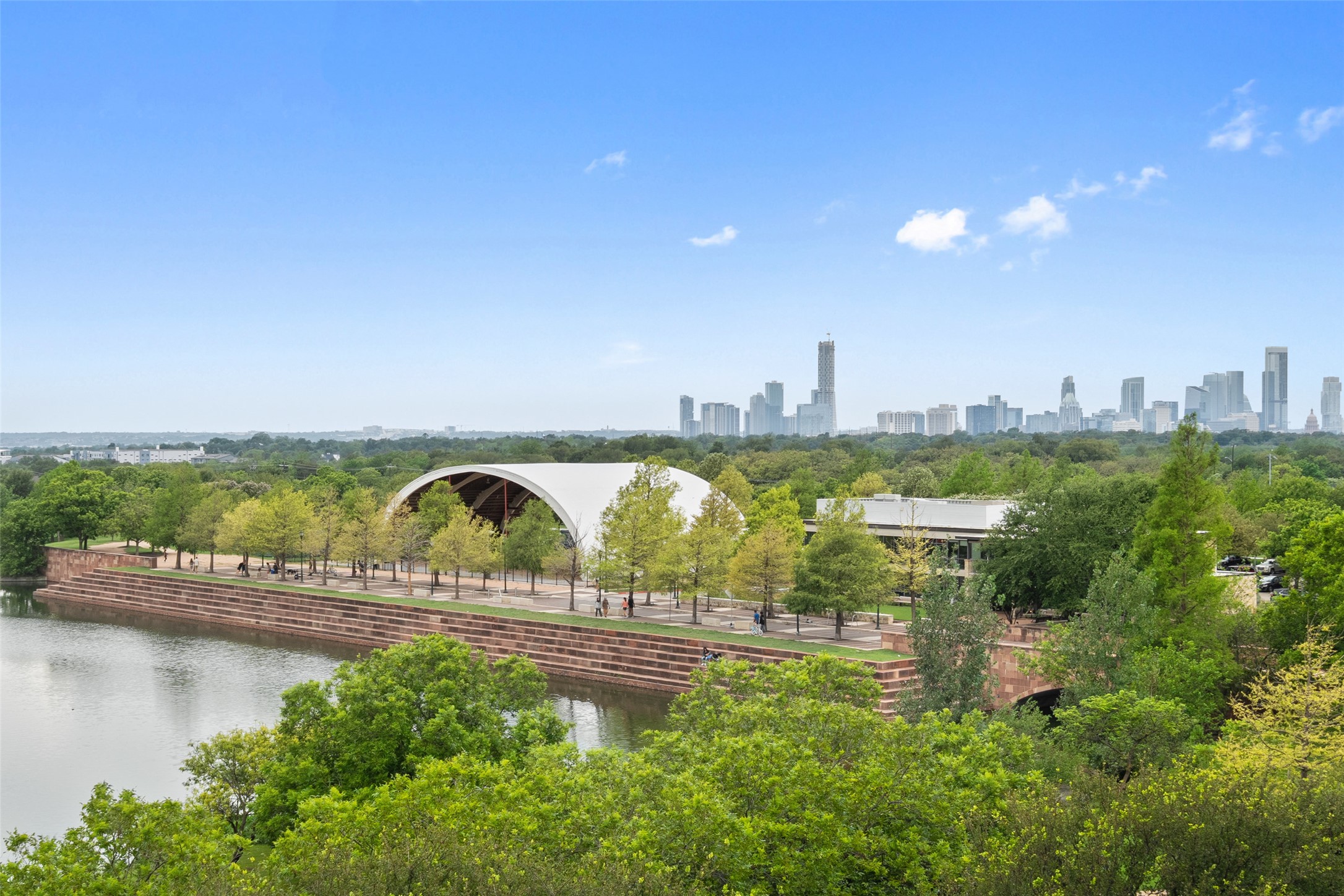 1701 Simond Avenue, Unit 305 Austin, TX 78723 - Photo 18 of 31 a view of swimming pool with outdoor seating and lake view