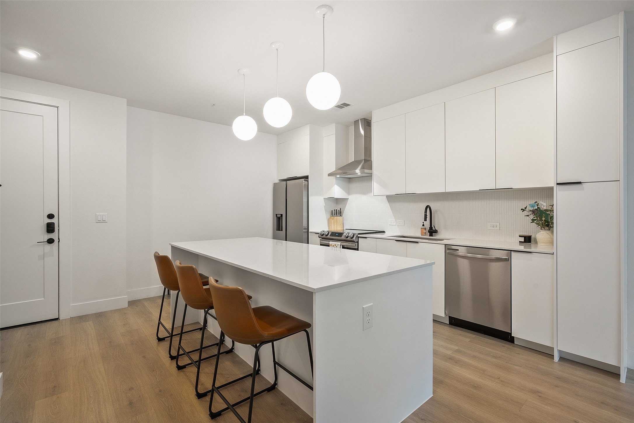 1701 Simond Avenue, Unit 305 Austin, TX 78723 - Photo 2 of 31 a kitchen with a sink cabinets and window