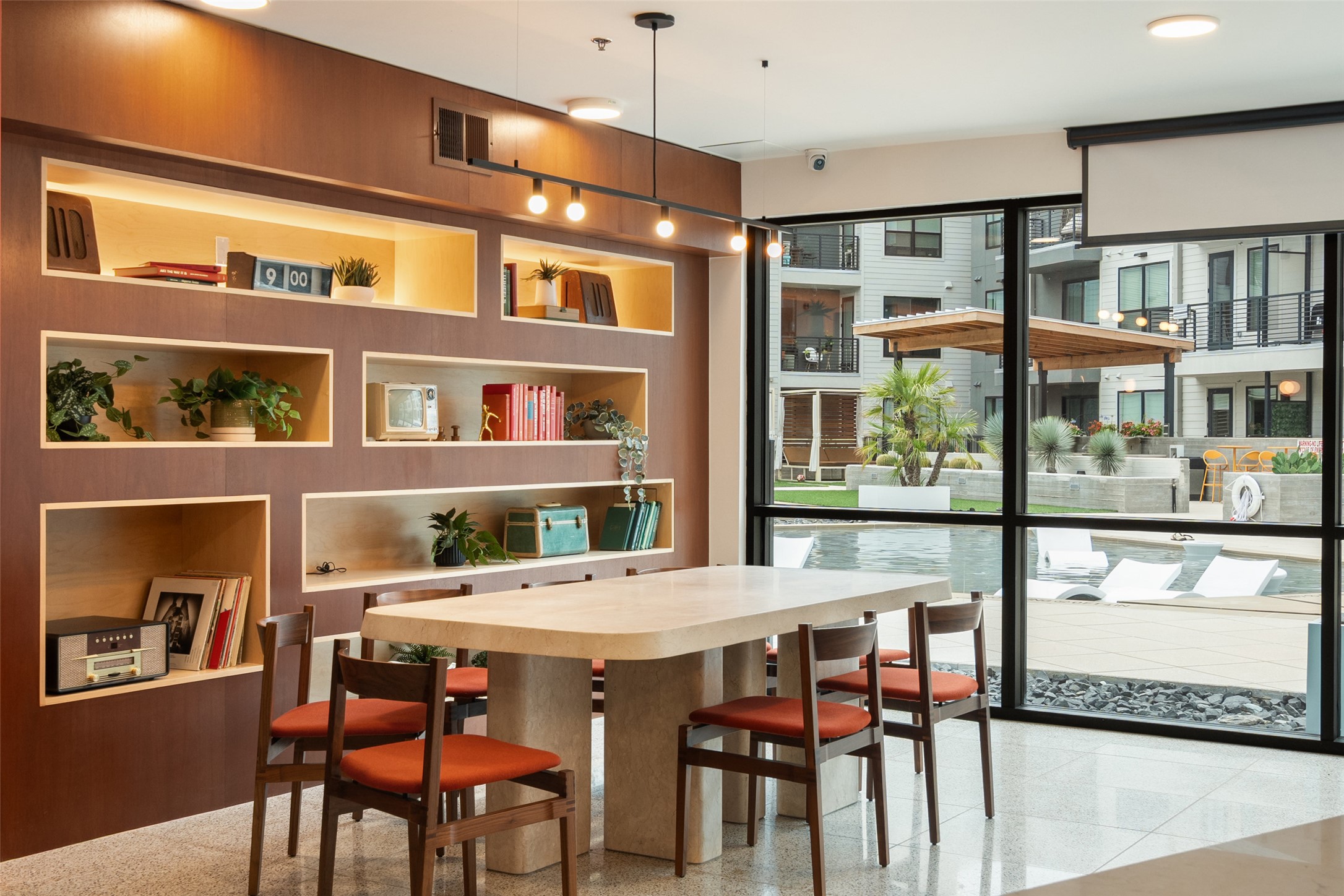 1701 Simond Avenue, Unit 305 Austin, TX 78723 - Photo 27 of 31 a dining room with stainless steel appliances granite countertop a dining table and chairs with floor to ceiling window