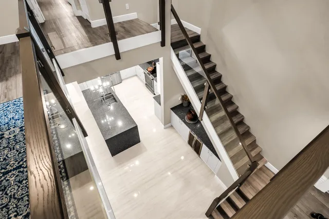 a spacious bedroom with a bed and a flat screen tv