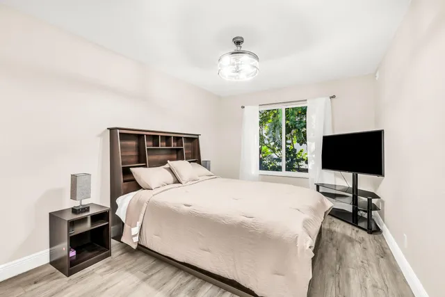 a kitchen with sink and a mirror