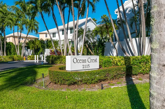 a view of a house with potted plants