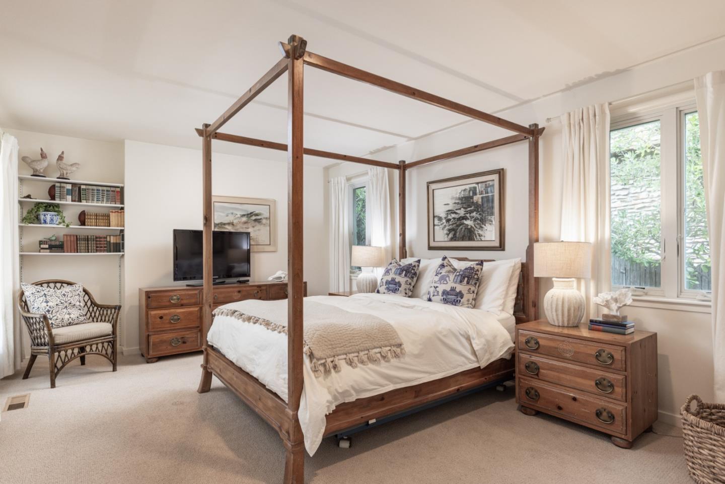 26177 Scenic Road Carmel, CA 93923 - Photo 22 of 30 a bedroom with a large bed and a window