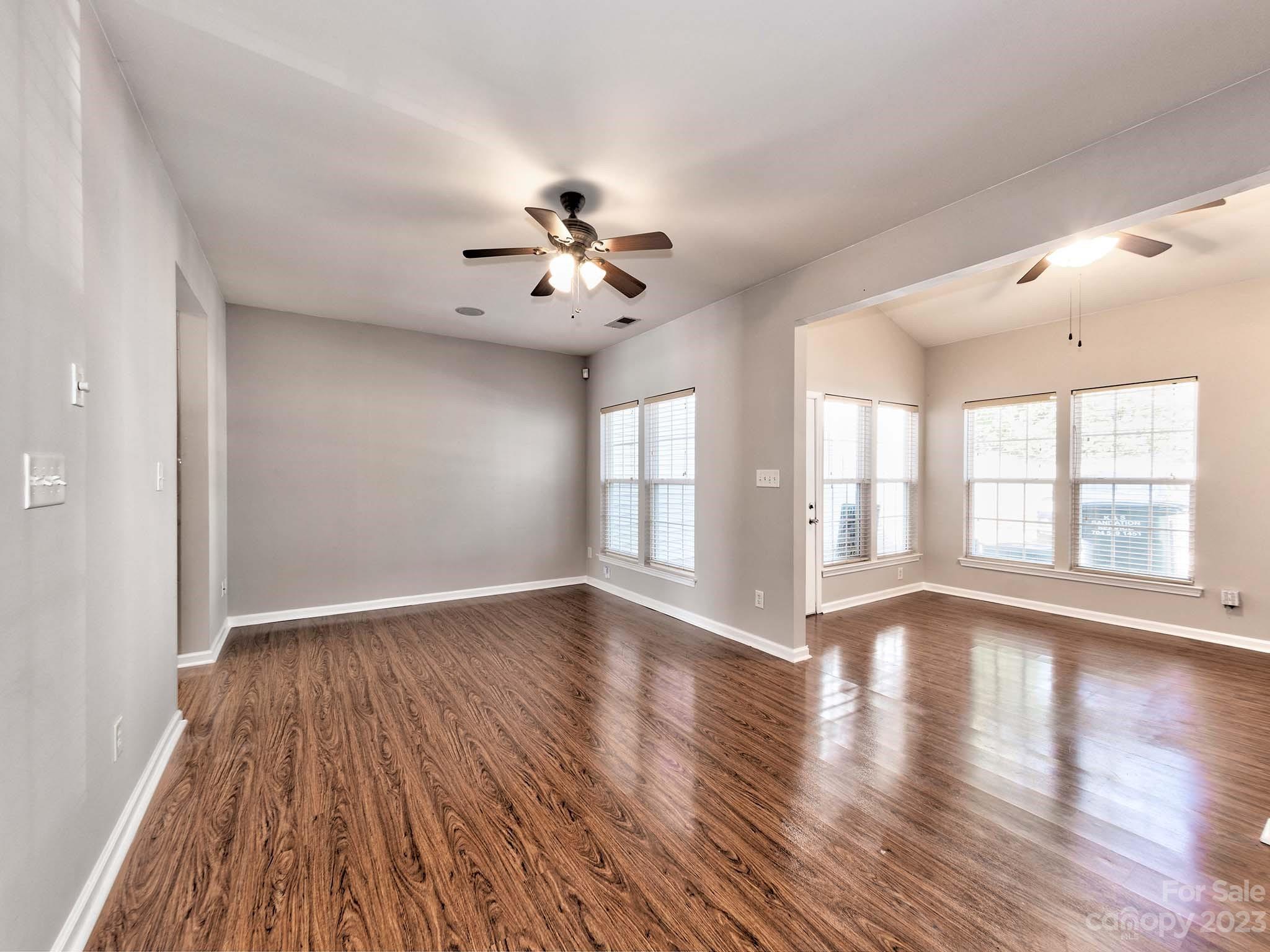 4849 Prosperity Ridge Road Charlotte, NC 28269 - Photo 11 of 40 a view of an empty room with wooden floor and a window