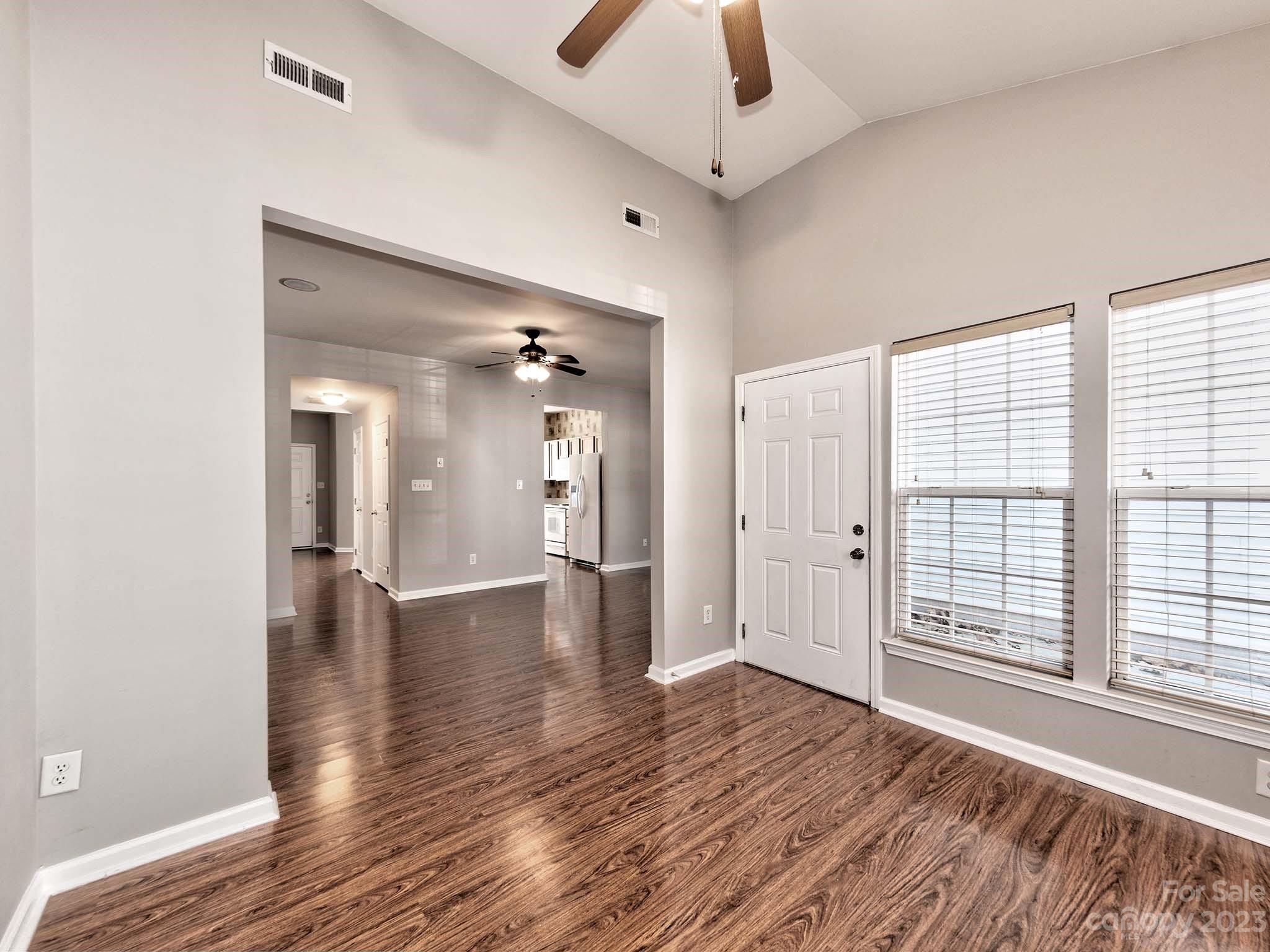 4849 Prosperity Ridge Road Charlotte, NC 28269 - Photo 14 of 40 wooden floor in an empty room with a window
