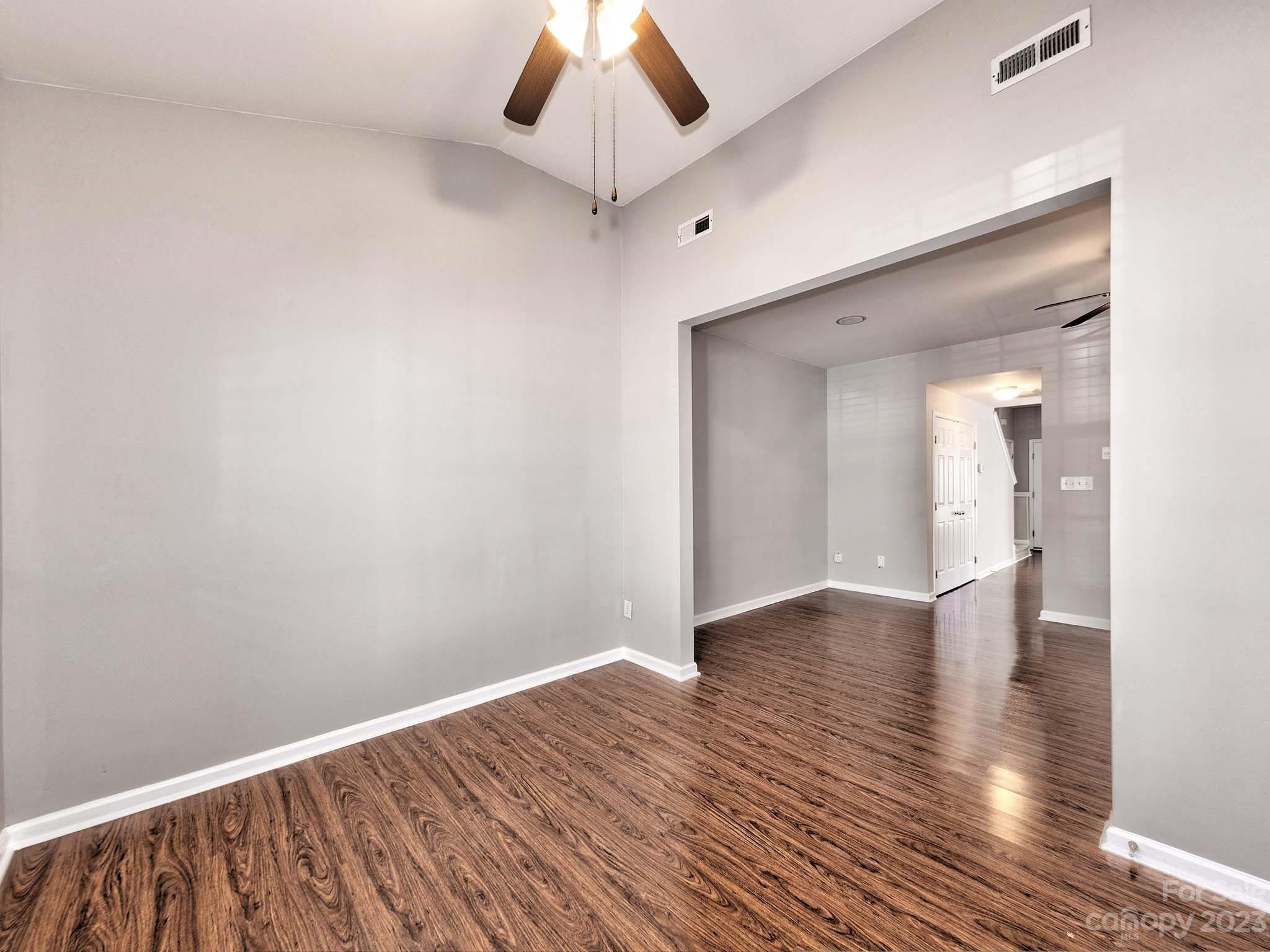 4849 Prosperity Ridge Road Charlotte, NC 28269 - Photo 16 of 40 a view of an empty room with wooden floor