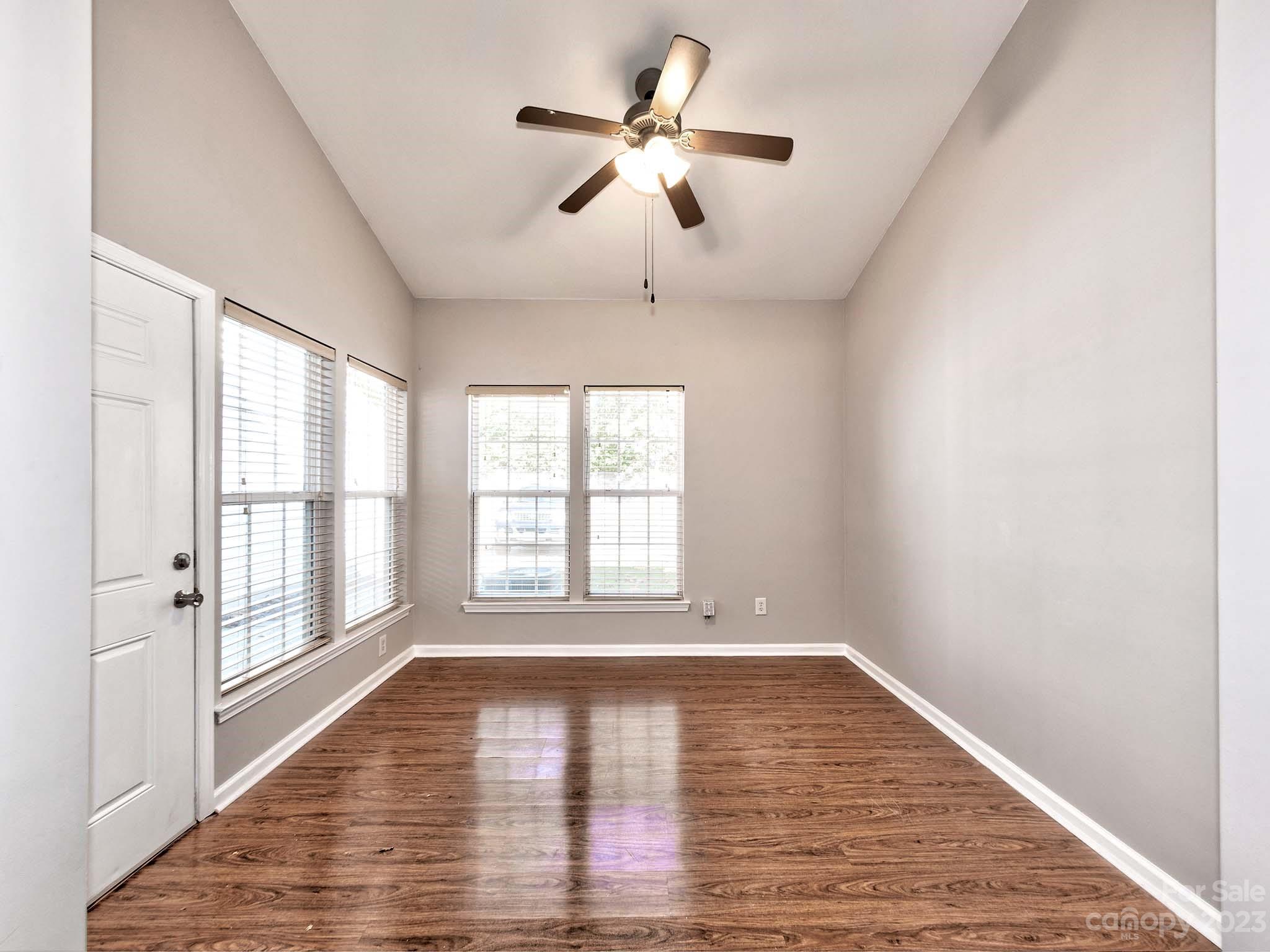4849 Prosperity Ridge Road Charlotte, NC 28269 - Photo 17 of 40 wooden floor in an empty room with a window