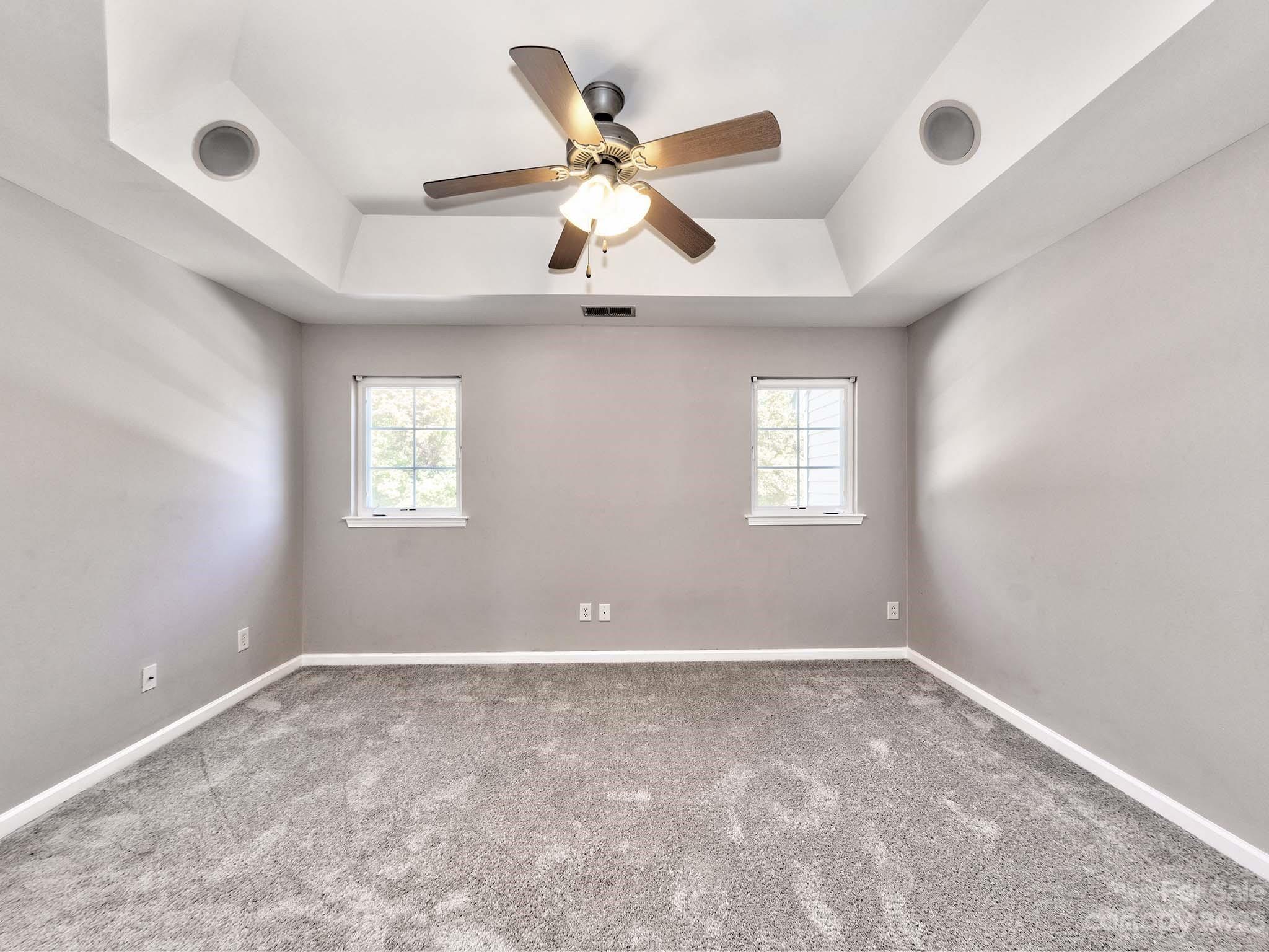 4849 Prosperity Ridge Road Charlotte, NC 28269 - Photo 24 of 40 a view of an empty room with a ceiling fan and window