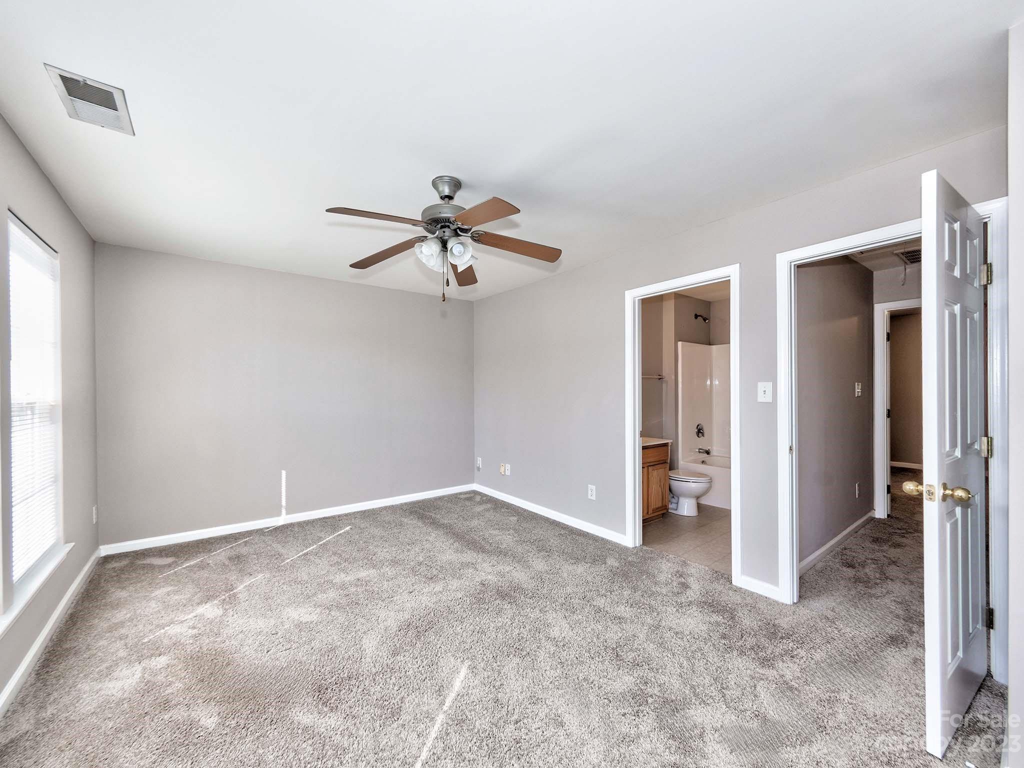 4849 Prosperity Ridge Road Charlotte, NC 28269 - Photo 30 of 40 a view of a livingroom with a ceiling fan and window