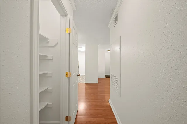a view of a bathroom from a hallway