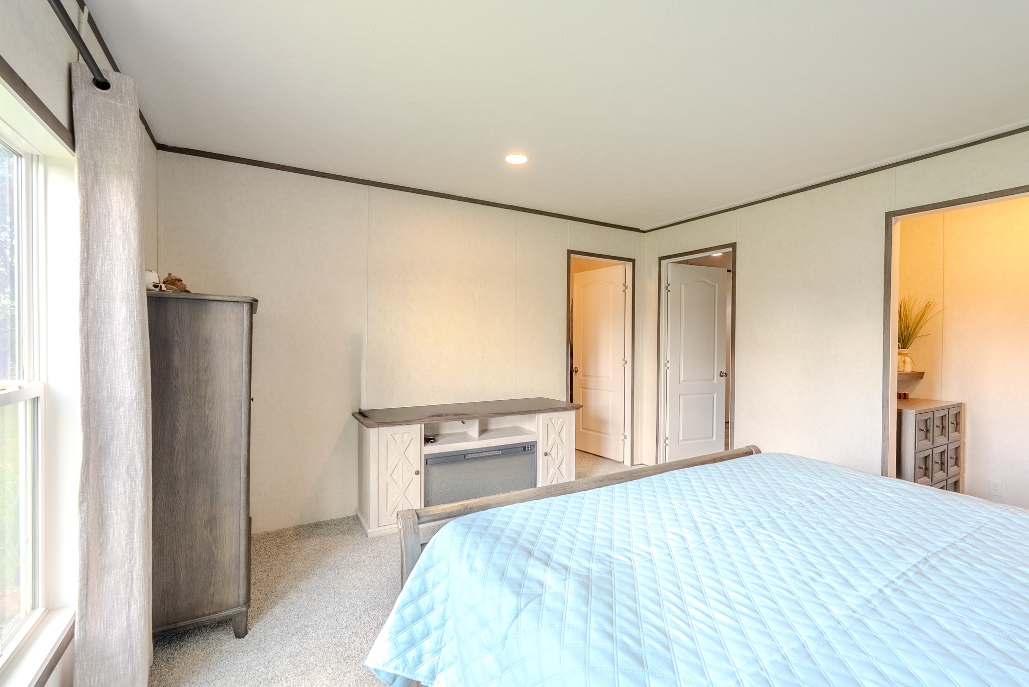 175 Lone Oak Drive Rickman, TN 38580 - Photo 16 of 37 a bedroom with a bed and a flat tv screen on dresser