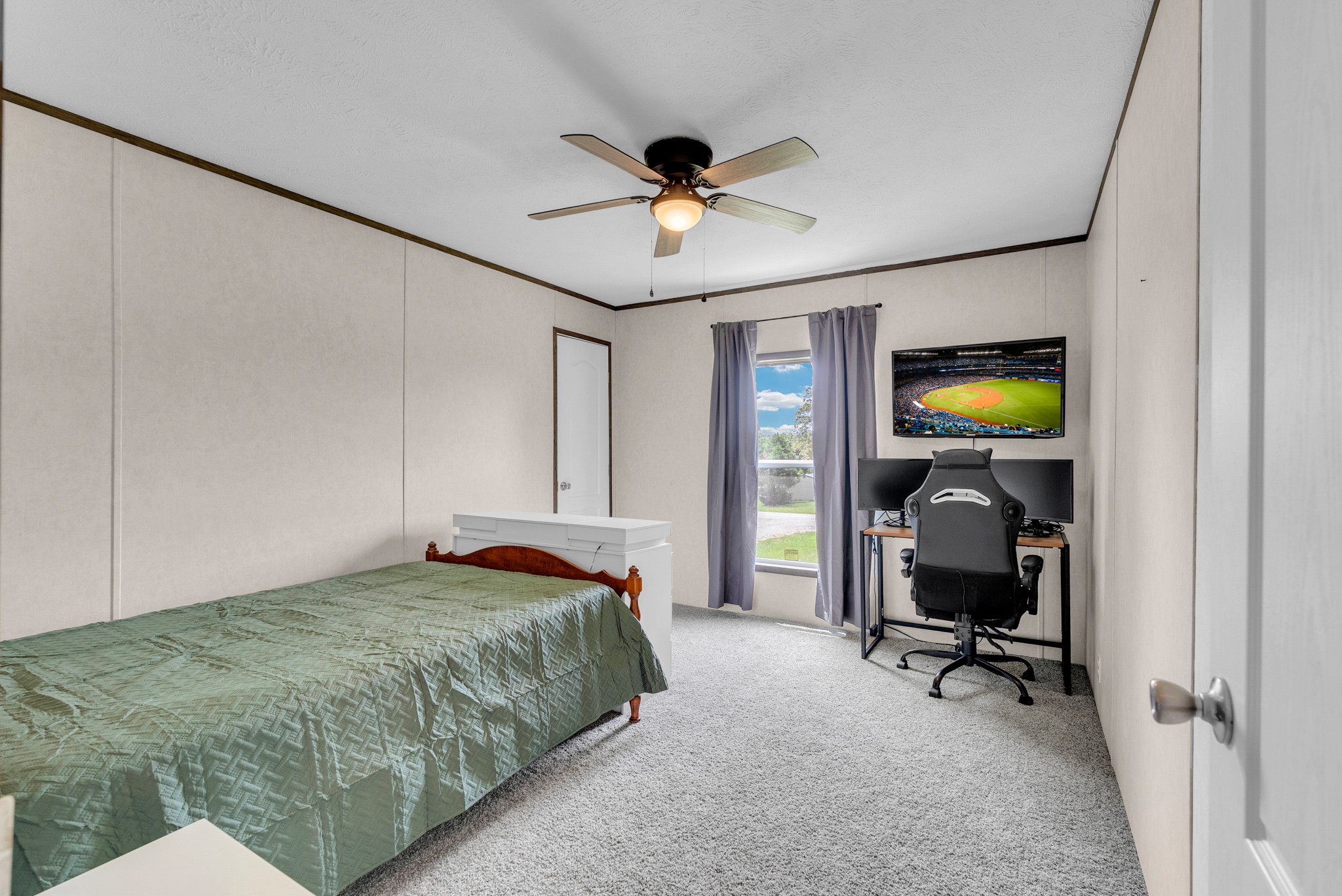 175 Lone Oak Drive Rickman, TN 38580 - Photo 19 of 37 a bedroom with a bed and a chandelier