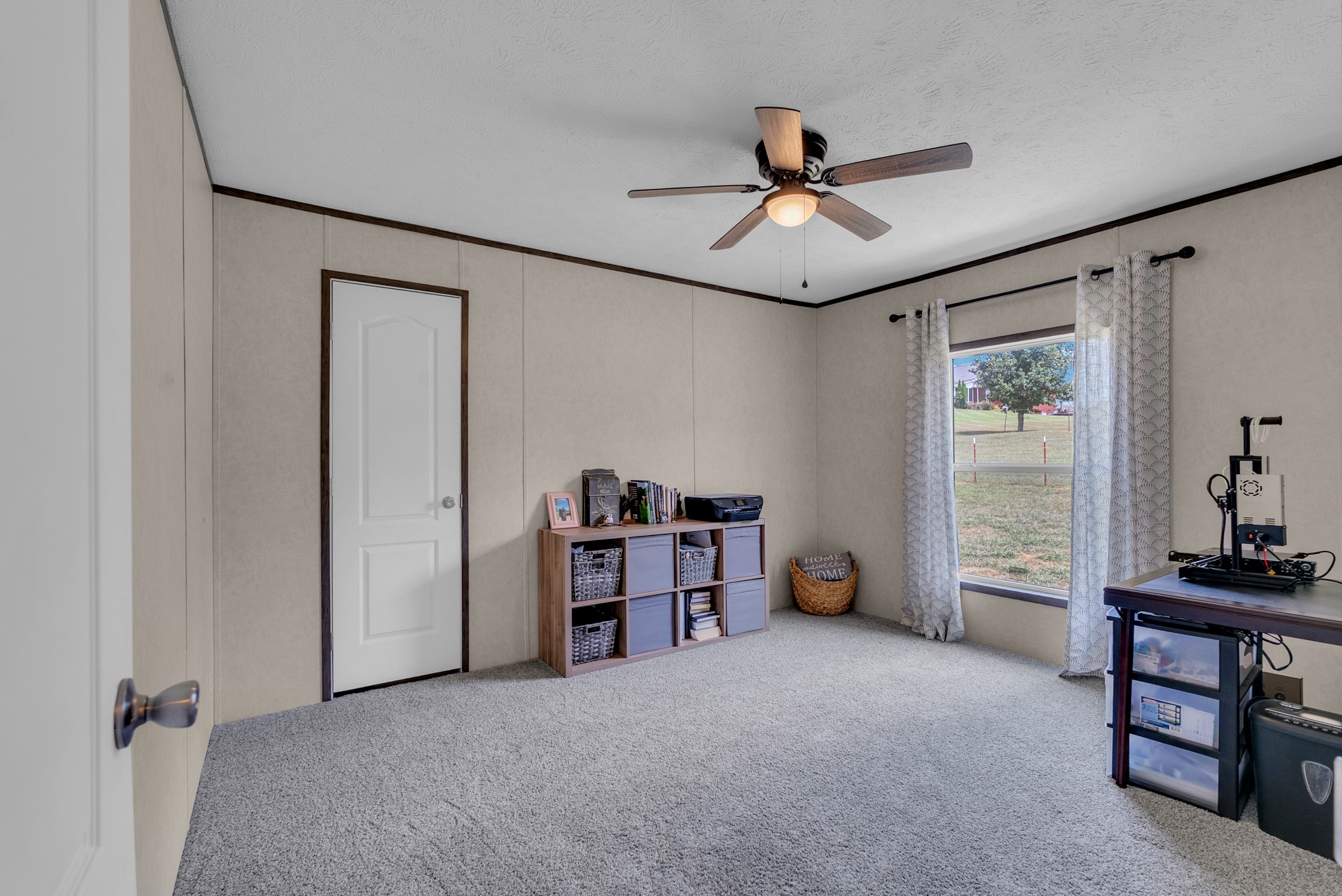 175 Lone Oak Drive Rickman, TN 38580 - Photo 20 of 37 a view of a livingroom with furniture and a ceiling fan