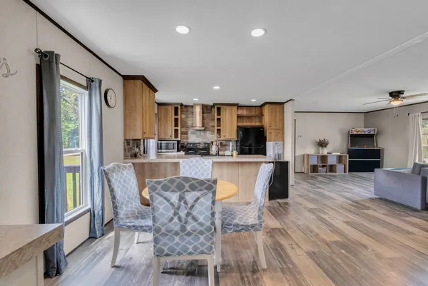 a view of a dining room with furniture window and wooden floor