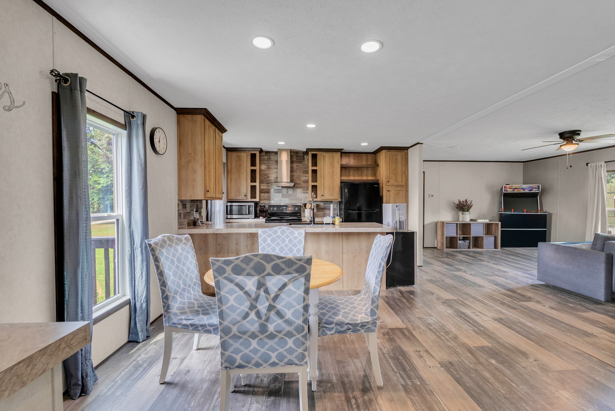 175 Lone Oak Drive Rickman, TN 38580 - Photo 7 of 37 a view of a dining room with furniture window and wooden floor