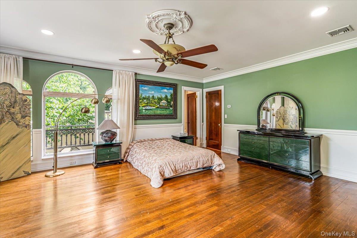 952 Cedar Swamp Road Glen Head, NY 11545 - Photo 23 of 50 a living room with a bed furniture and a large window