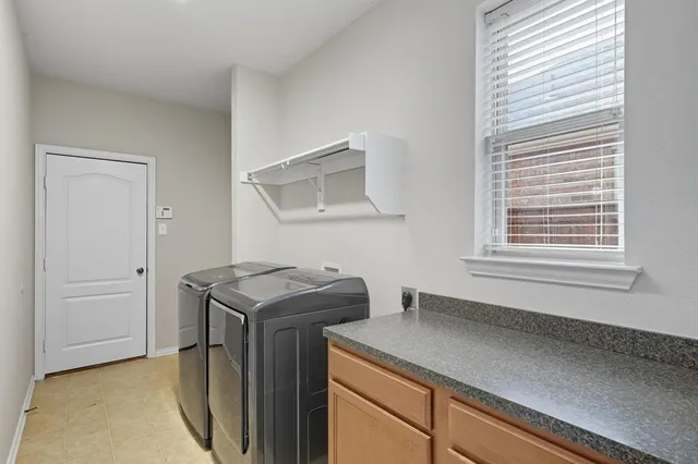 a utility room with washer and dryer