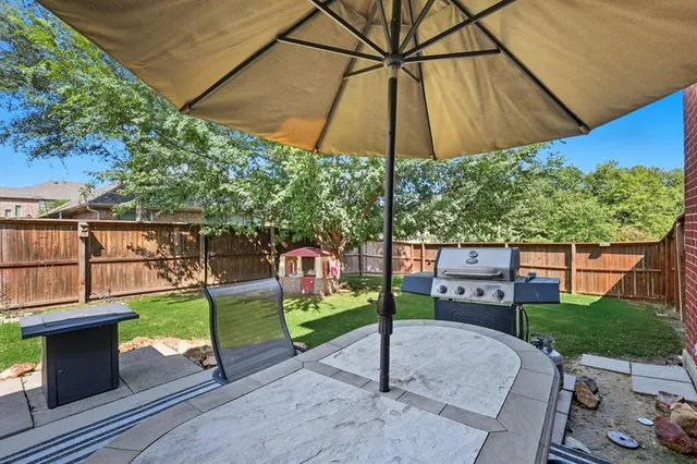 a view of a backyard with a patio