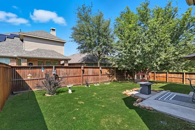a view of a backyard with a garden