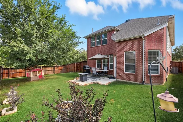 a view of a house with a yard porch and sitting area