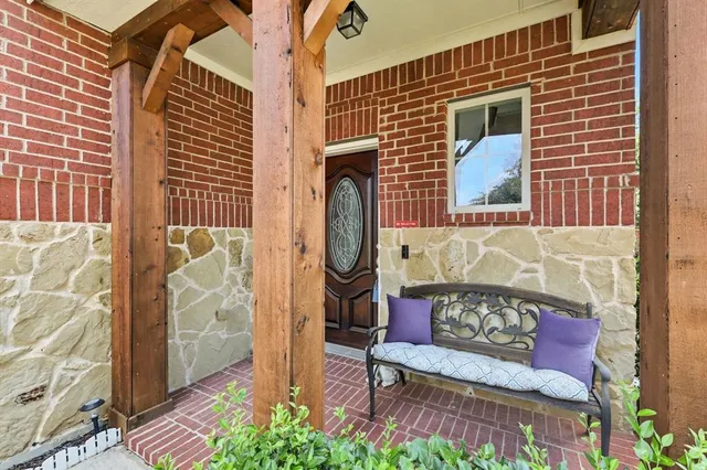 a view of a door with a bench in the house