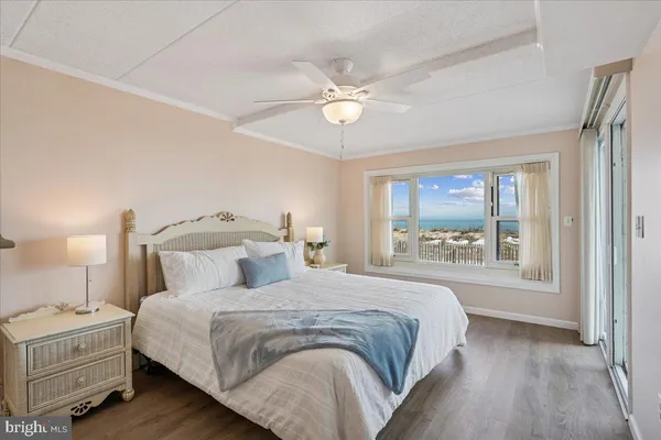 a bedroom with a large bed and a window