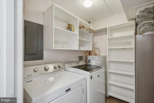 a view of storage and utility room with washer and dryer
