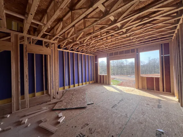 a view of an empty room with a balcony