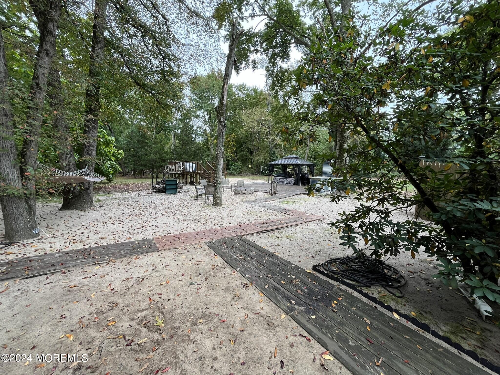 189 Tennent Road Morganville, NJ 07751 - Photo 35 of 45 a view of a outdoor space with a patio