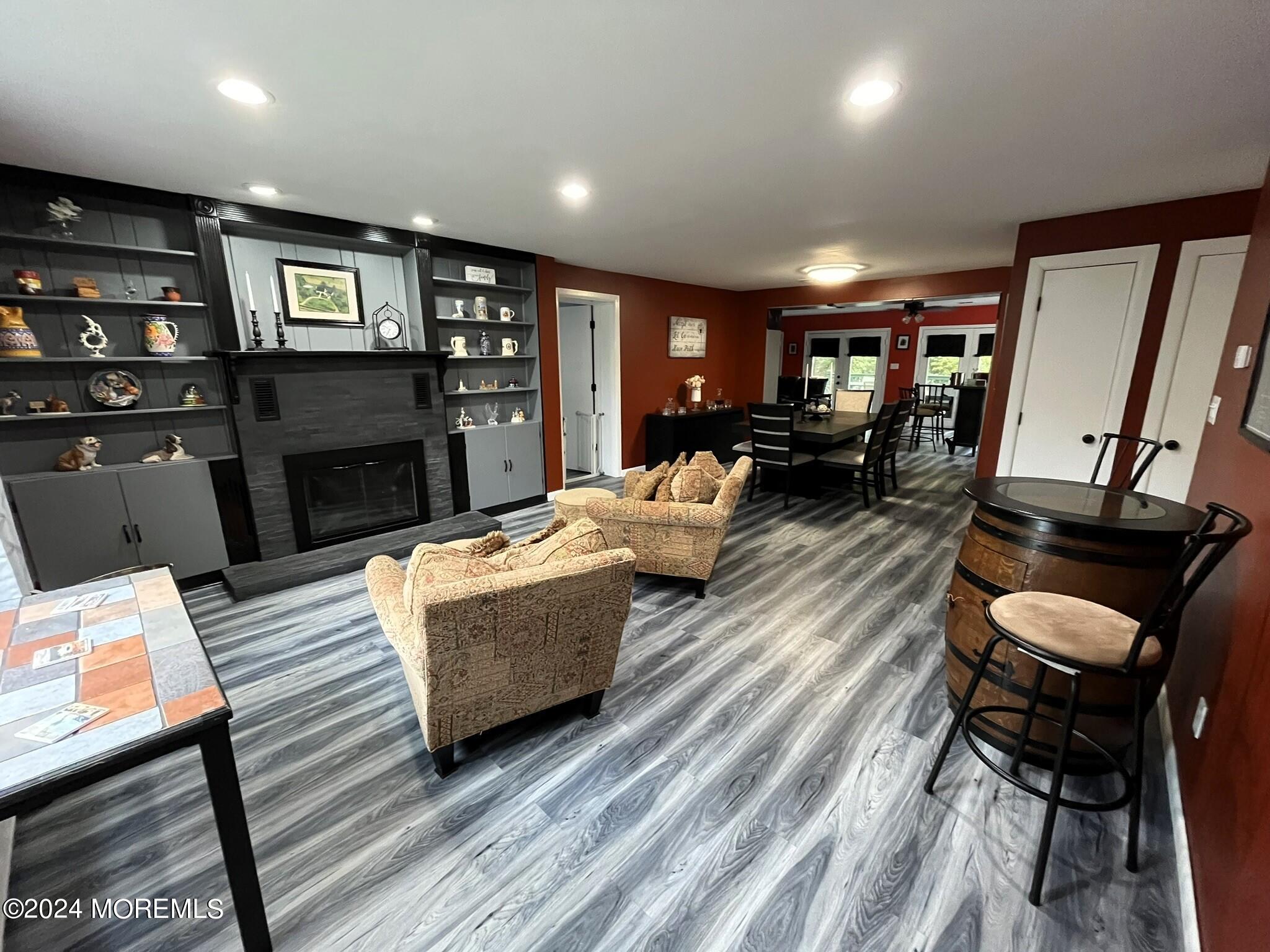 189 Tennent Road Morganville, NJ 07751 - Photo 5 of 45 a living room with fireplace furniture and a flat screen tv
