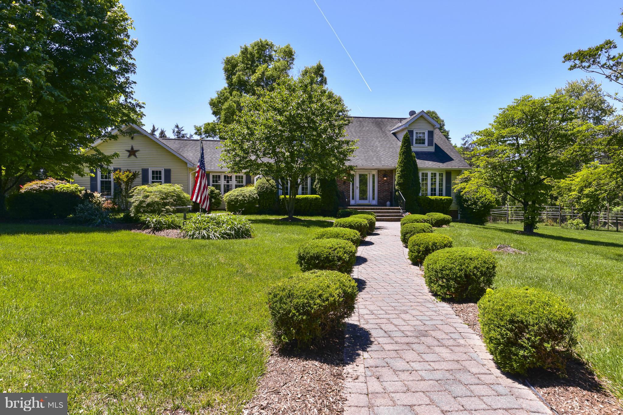 8033 Waterloo Farm Road Warrenton, VA 20186 - Photo 1 of 30 a front view of a house with a yard and potted plants