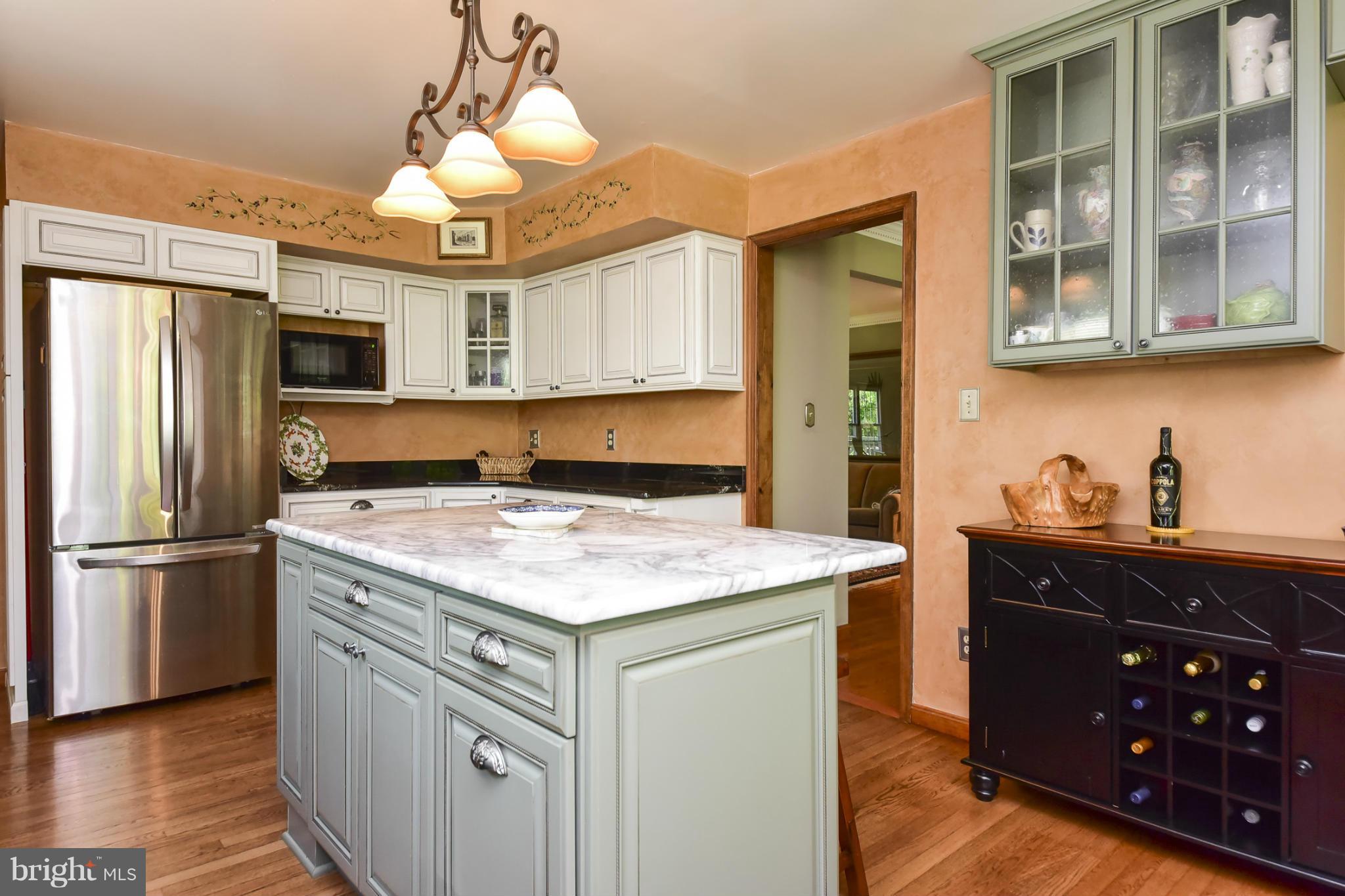 8033 Waterloo Farm Road Warrenton, VA 20186 - Photo 13 of 30 a kitchen with stainless steel appliances granite countertop a sink stove and refrigerator