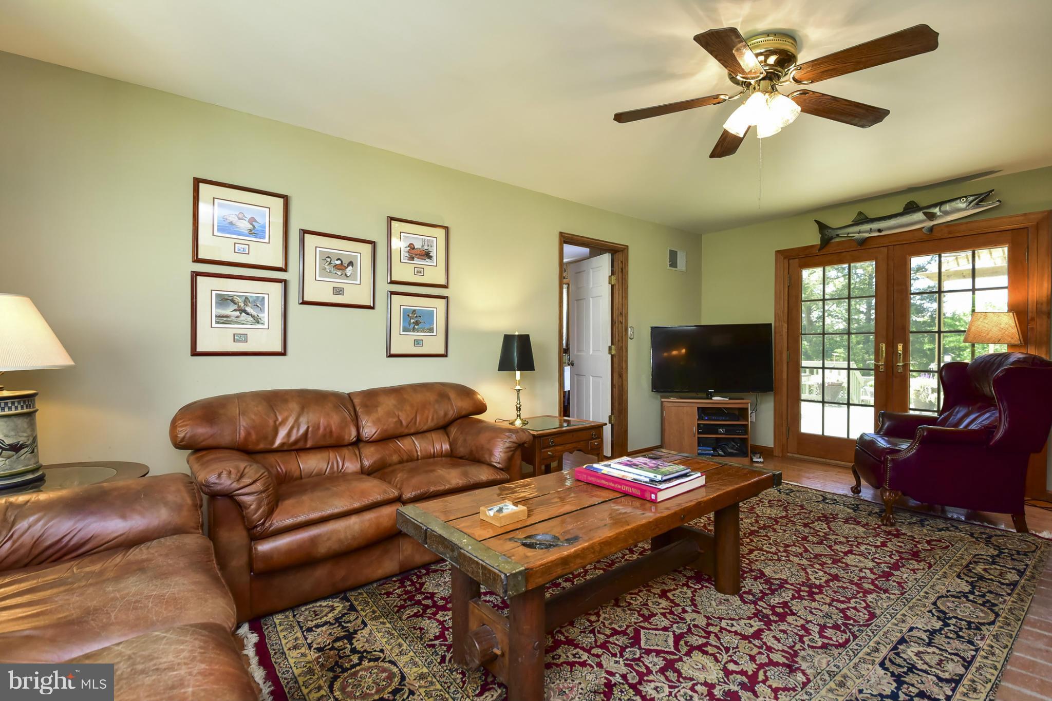 8033 Waterloo Farm Road Warrenton, VA 20186 - Photo 15 of 30 a living room with furniture and a flat screen tv
