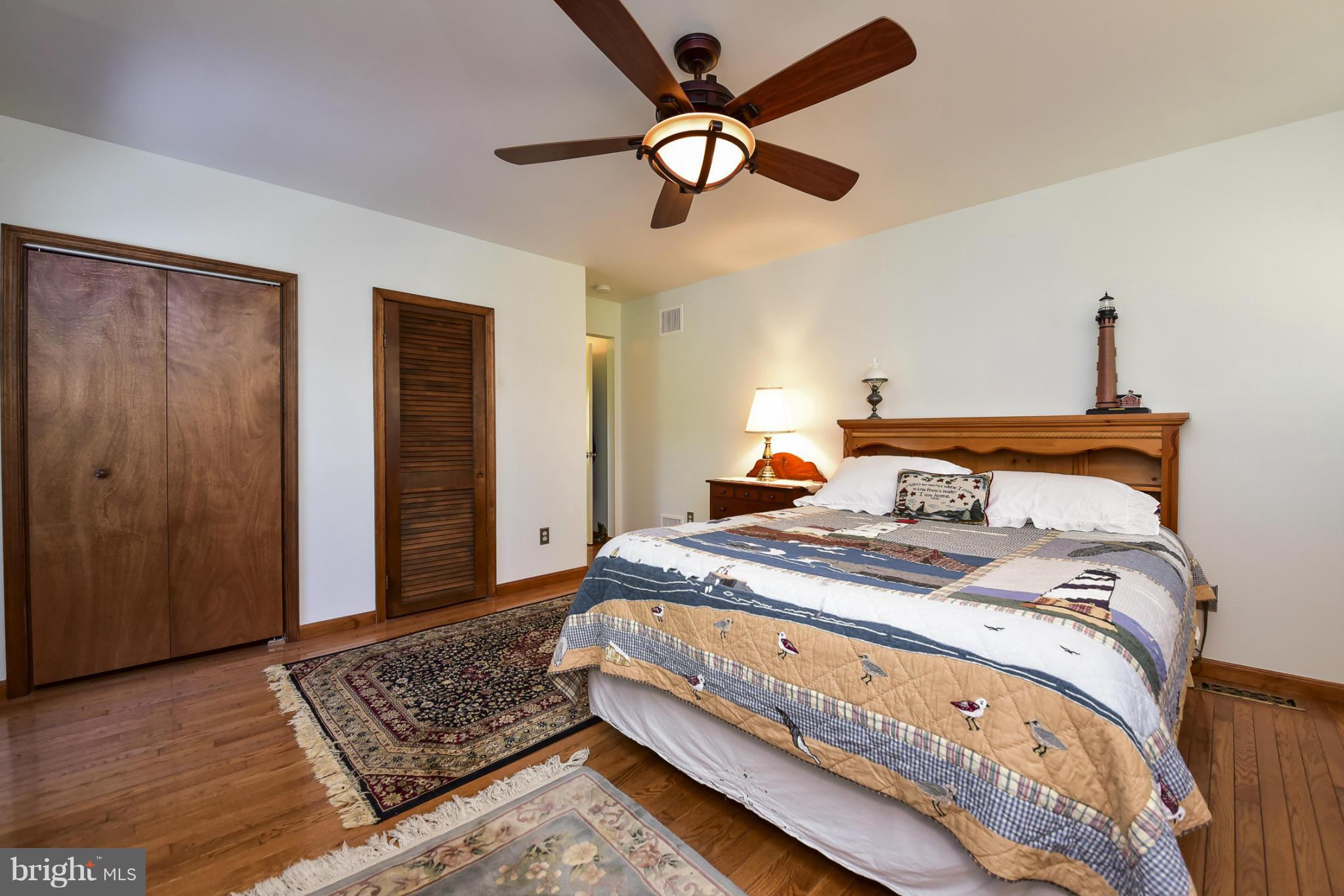 8033 Waterloo Farm Road Warrenton, VA 20186 - Photo 17 of 30 a bed room with a bed and a ceiling fan