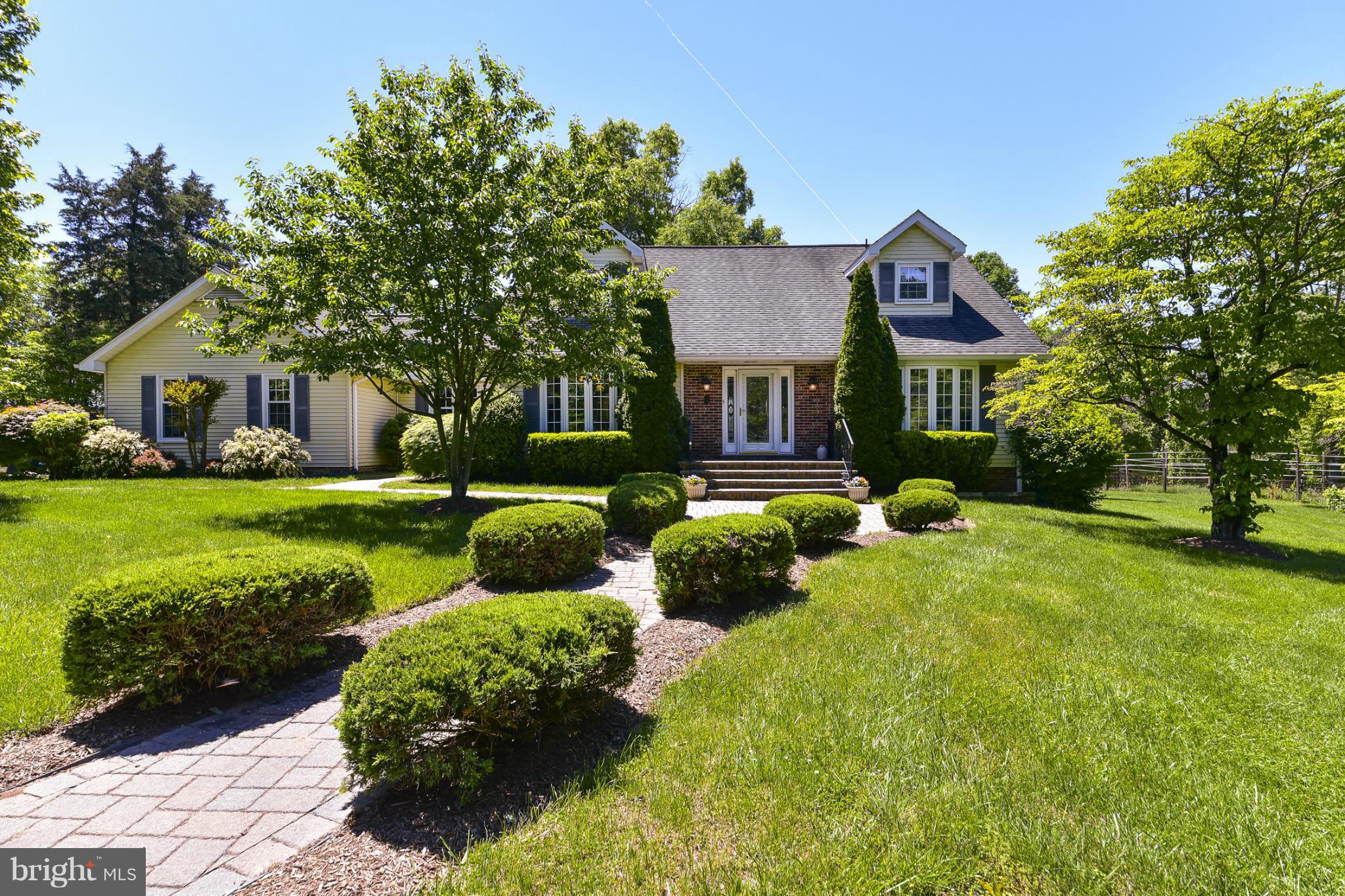 8033 Waterloo Farm Road Warrenton, VA 20186 - Photo 3 of 30 a front view of a house with garden