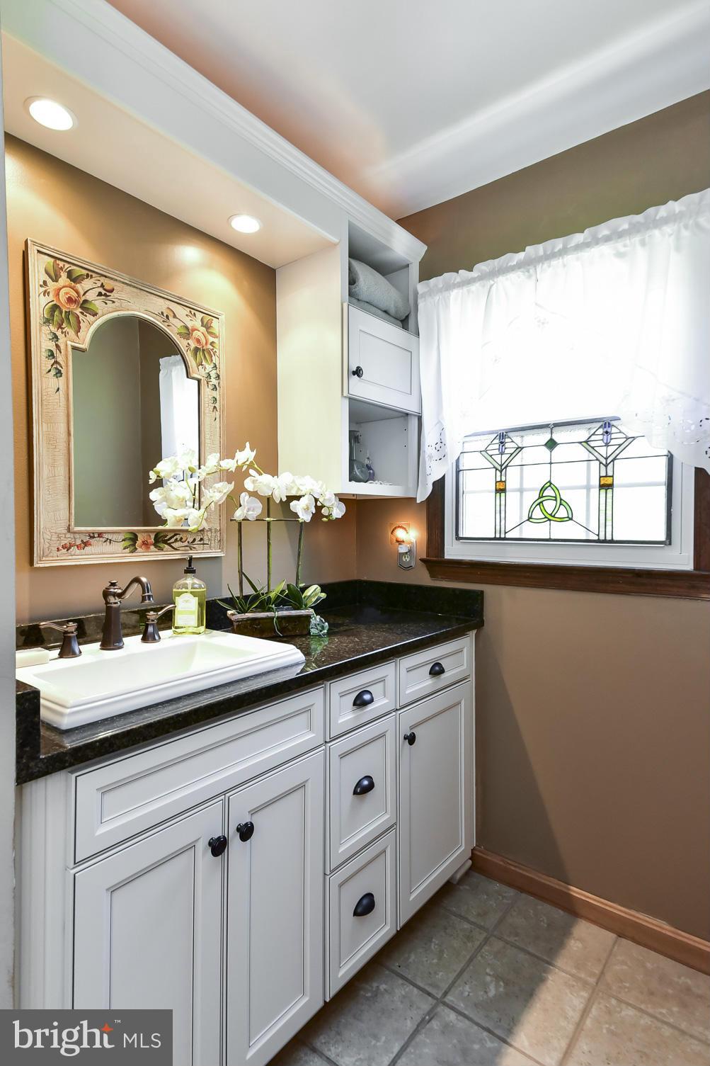 8033 Waterloo Farm Road Warrenton, VA 20186 - Photo 22 of 30 a kitchen with granite countertop a sink and cabinets