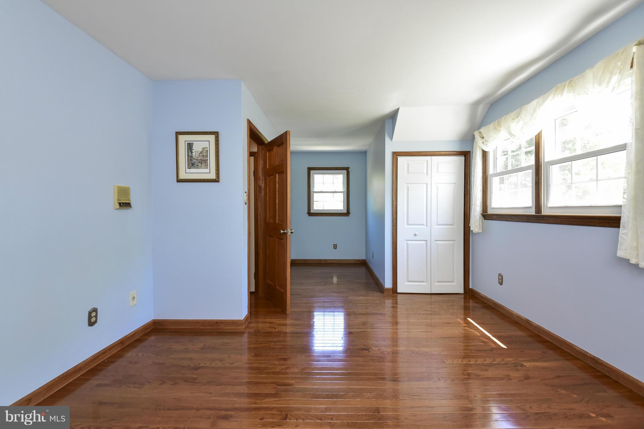 8033 Waterloo Farm Road Warrenton, VA 20186 - Photo 23 of 30 a view of empty room with wooden floor and fan